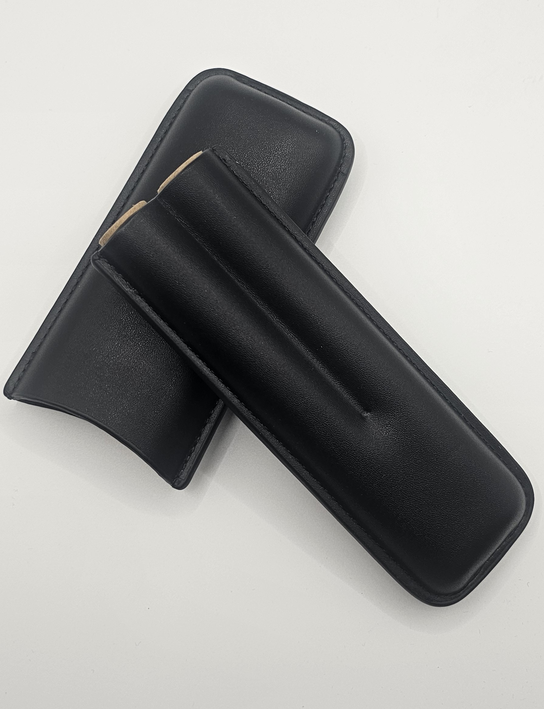 one 2 fingered black leather cigar case opened